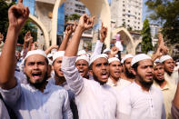Supporters of Islami Oikya Jote, an Islamist political party, protest against French President Emmanuel Macron and against the publishing of caricatures of the Prophet Muhammad they deem blasphemous, in Dhaka, Bangladesh, Wednesday, Oct. 28, 2020. Muslims in the Middle East and beyond on Monday called for boycotts of French products and for protests over the caricatures, but Macron has vowed his country will not back down from its secular ideals and defense of free speech. Posters read "France is the enemy of humanity. World citizens fight back." second left, "Muslims of the world stand against insults to the prophet," third right and "Stop buying products from France. In the name of the Prophet," left. (AP Photo/Mahmud Hossain Opu)