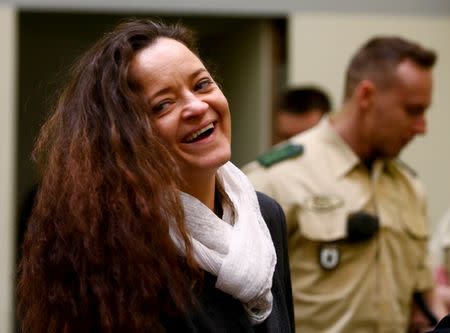 Defendant Beate Zschaepe arrives for the continuation of her trial at a courtroom in Munich, southern Germany, January 12, 2016. REUTERS/Michael Dalder/File Photo