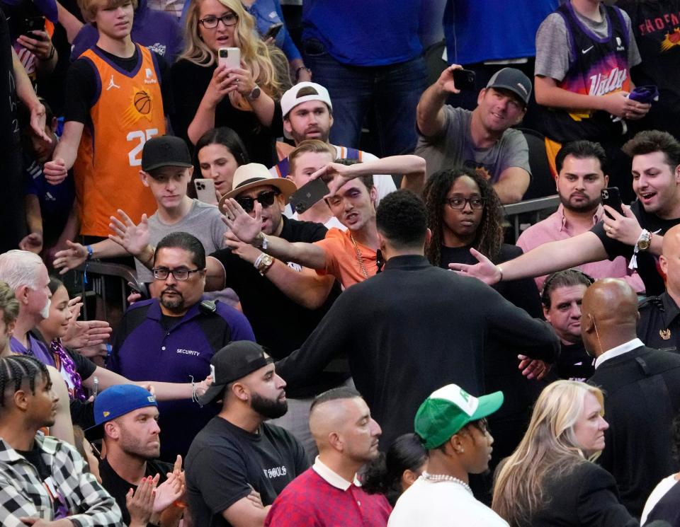 May 15, 2022; Phoenix, Ariz. U.S.; Phoenix Suns guard Devin Booker slaps hands with fans after losing game 7 of the Western Conference semifinals against the Dallas Mavericks at Footprint Center.