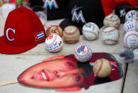 <p>Baseballs and other memorabilia are left at a makeshift memorial created by fans mourning the death due to a boating accident of Miami Marlins pitcher Jose Fernandez, outside Marlins Park prior to a game against the New York Mets in Miami, Florida, September 26, 2016. (Andrew Innerarity/Reuters)</p>