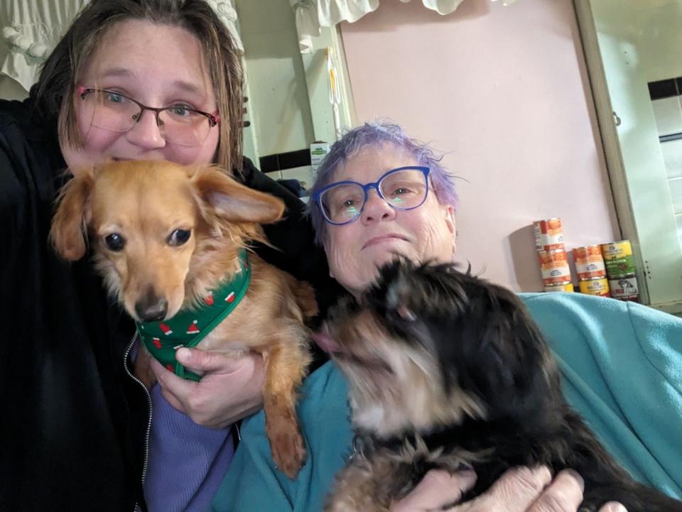 Dr. Mariah Covey, Gina Covey and dog friends pose for a selfie. Gina Covey participated in bidding to have her daughter’s name used in a novel by David Rosenfeld, who writes the Andy Carpenter crime novels. The proceeds benefit the Marshall County Humane Society.