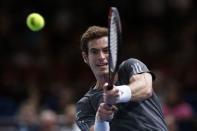 Andy Murray of Britain returns a shot during his men's singles tennis match against Grigor Dimitrov of Bulgaria in the third round of the Paris Masters tennis tournament at the Bercy sports hall in Paris, October 30, 2014. REUTERS/Benoit Tessier