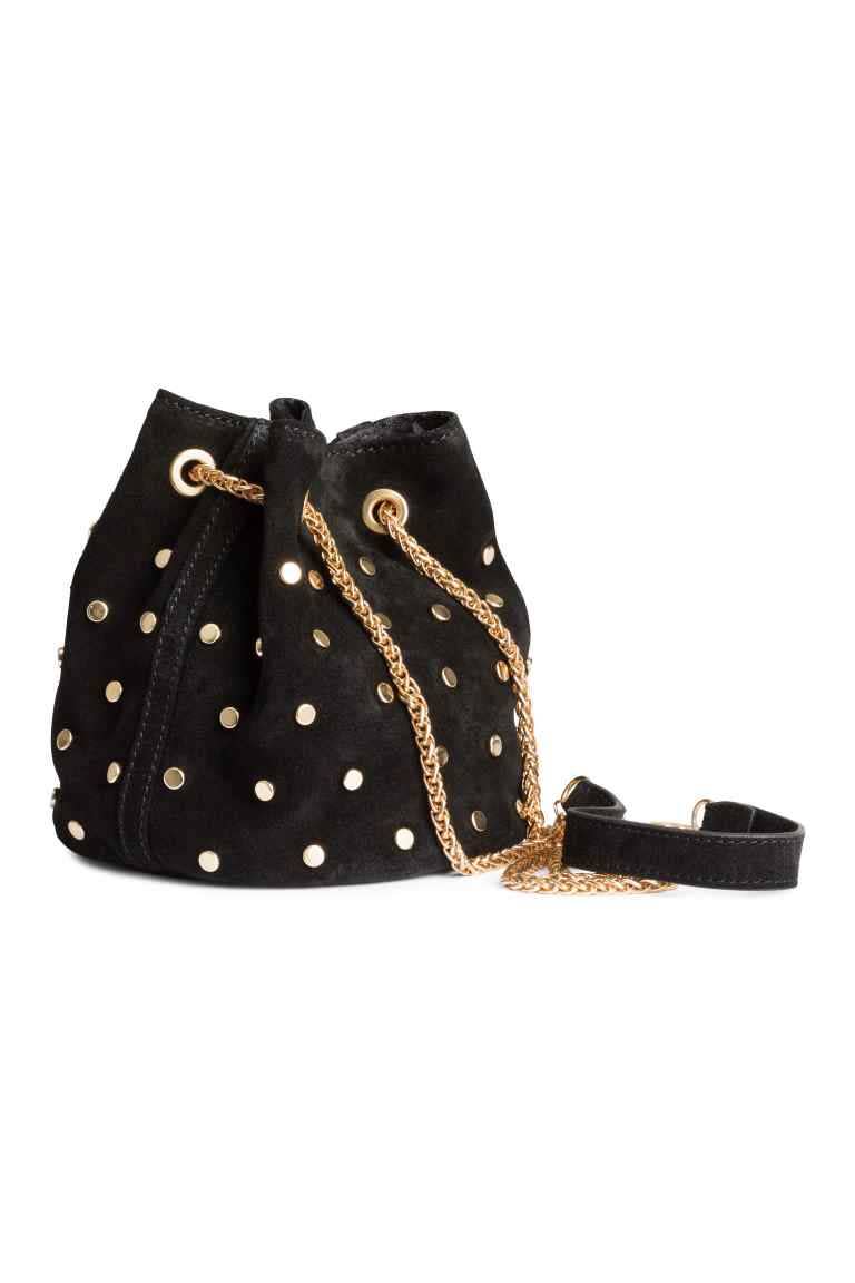 <p>A studded suede bucket bag is bound to be useful all year round. Plus, it would look very stylish on your shoulder <i><a href="http://www2.hm.com/en_gb/productpage.0334792001.html" rel="nofollow noopener" target="_blank" data-ylk="slk:[£29.99];elm:context_link;itc:0;sec:content-canvas" class="link ">[£29.99]</a></i></p>