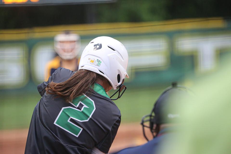 Eastern Alamance's Kenzie Taylor swings at a pitch.