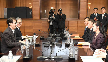 South Korean singer and chief delegate Yun Sang talks with Hyon Song Wol, head of the Samjiyon Orchestra, during their meeting at the truce village of Panmunjom, North Korea, March 20, 2018. The Unification Ministry/Yonhap via REUTERS