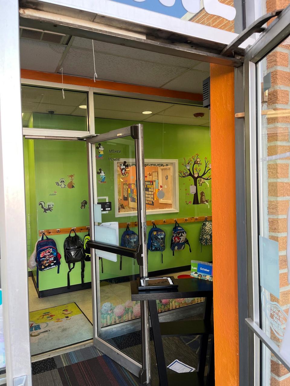 Children's backpacks can be seen from the entrance way of Happy Smiles Learning Center in Allentown, Pa., after a carbon monoxide leak was reported, Tuesday, Oct. 11, 2022.