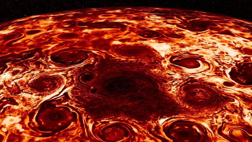 jupiter north pole large dark spot encircled by eight red cyclones