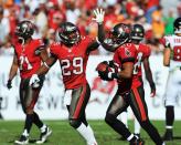 TAMPA, FL - NOVEMBER 25: Defensive back Ronde Barber #20 of the Tampa Bay Buccaneers celebrates a second-quarter interception with cornerback Leonard Johnson #29 against the Atlanta Falcons November 25, 2012 at Raymond James Stadium in Tampa, Florida. (Photo by Al Messerschmidt/Getty Images)