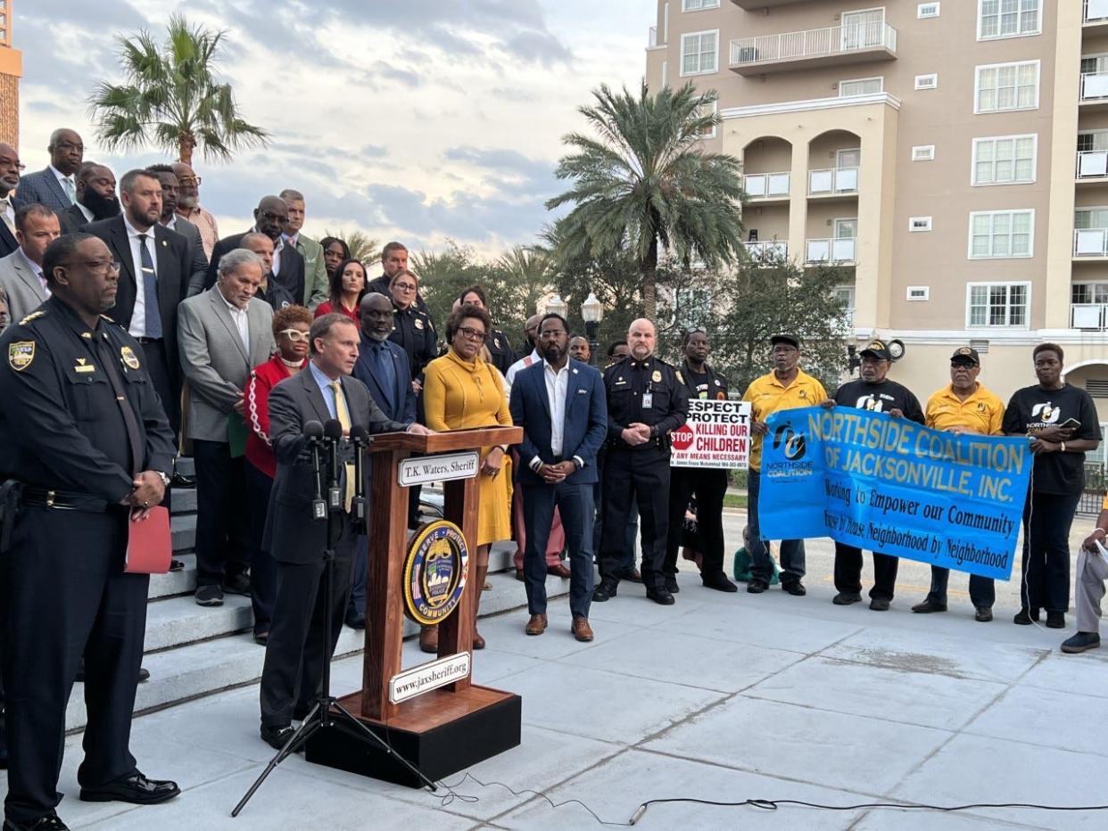 Jacksonville Mayor Lenny Curry speaks the violence over the weekend after newly elected Sheriff T.K. Waters, left, addressed it as well during a news conference Monday. A group of local politicians and nonprofit and religious leaders stood in support. Members of the Northside Coalition of Jacksonville also attended to advocate for new policing tactics.