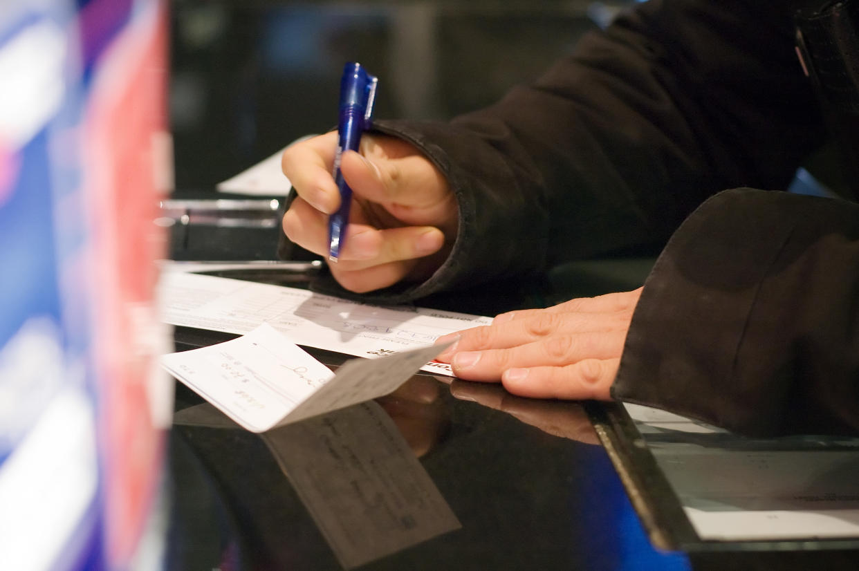 Person writing Check