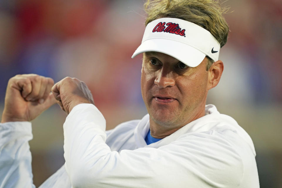 FILE - Mississippi head coach Lane Kiffin gestures following his team's 31-17 win over LSU during an NCAA college football game in Oxford, Miss., Saturday, Oct. 23, 2021. Mississippi coach Lane Kiffin signed 17 players from the transfer portal. The group is ranked the No. 2 transfer portal class by 247Sports.(AP Photo/Rogelio V. Solis, File)