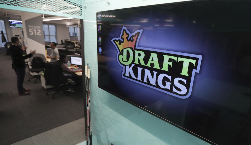 The DraftKings logo is displayed at the sports betting company headquarters, Thursday, May 2, 2019, in Boston. (AP Photo/Charles Krupa)