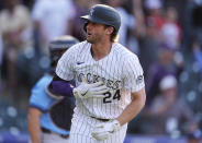 Colorado Rockies' Ryan McMahon looks to the dugout as he heads up the first base line after hitting a walkoff grand slam off Tampa Bay Rays pitcher Jason Adam in the ninth inning of a baseball game Friday, April 5, 2024, in Denver. (AP Photo/David Zalubowski)