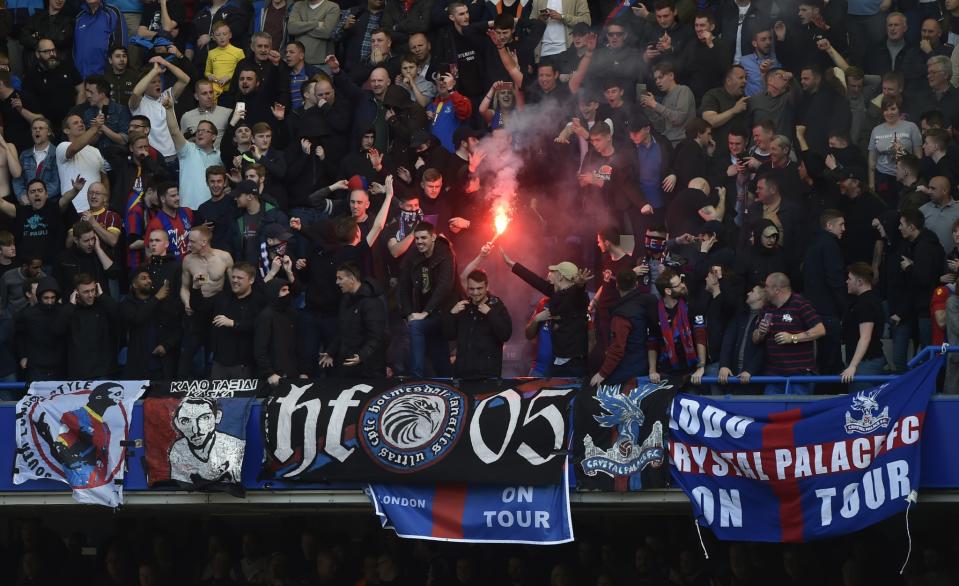 <p>Crystal Palace fans light a flare </p>