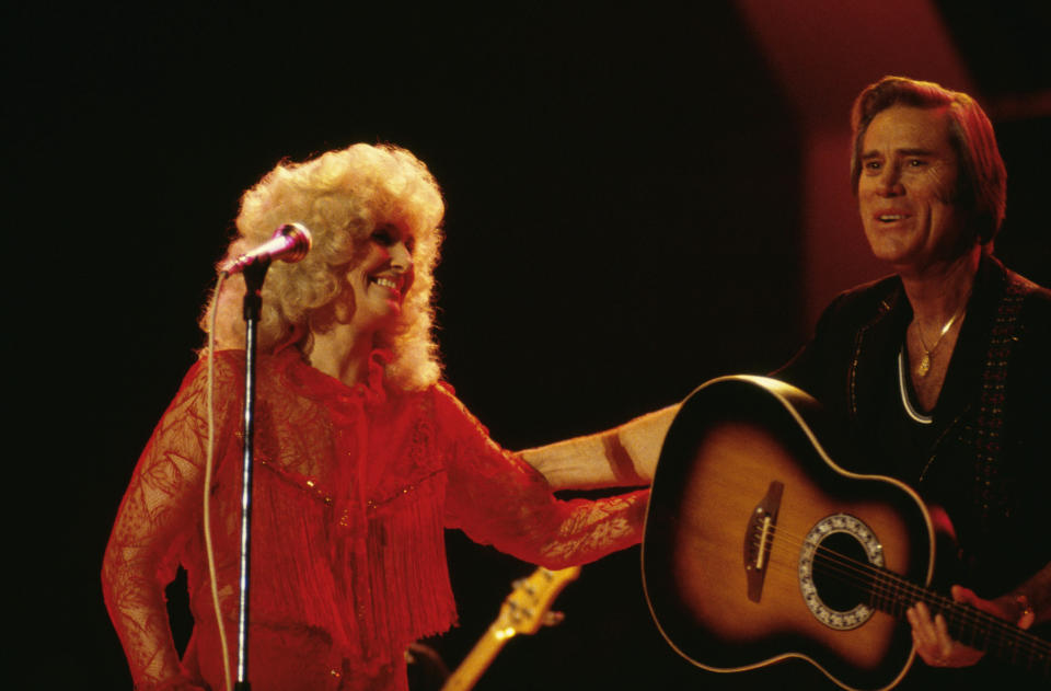 LONDON, APRIL 1: Country artists Tammy Wynette (1942-1998) and George Jones perform on stage at the Country Music Festival, Wembley Arena, London in April 1981. (Photo by David Redfern/Redferns)