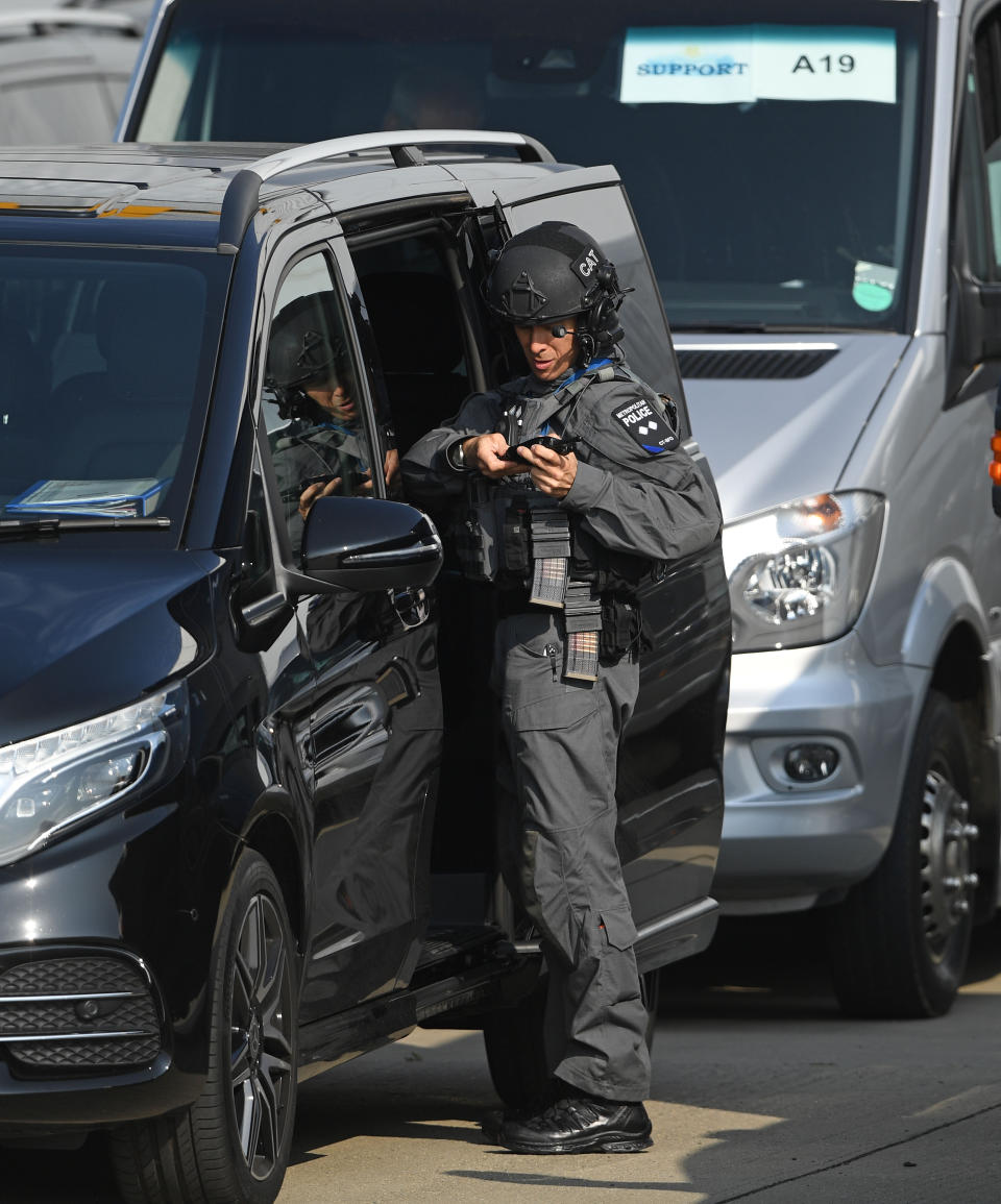 Police officers alongside their vehicles at Stansted airport in Essex ahead of the arrival there of US President Donald Trump and his wife Melania, aboard Air Force One, for the start of his three day state visit to the UK.