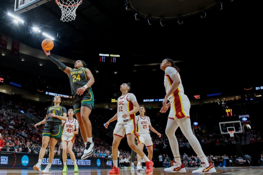 PORTLAND, OREGON – MARCH 30: Sarah Andrews #24 of the Baylor Lady Bears shoots over JuJu Watkins #12 of the USC Trojans during the first half in the Sweet 16 round of the NCAA Women’s Basketball Tournament at Moda Center on March 30, 2024 in Portland, Oregon. (Photo by Soobum Im/Getty Images)