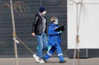 A man walks outside a hospital for patients infected with coronavirus disease in Moscow
