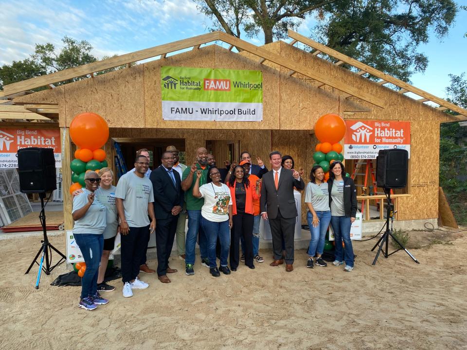 Big Bend Habitat for Humanity, FAMU and Whirlpool Corporation team up to build a home for a Tallahassee family on Disston Street. The new owner, Lynesia White, holds the key to her new home during a Mid Build House Dedication ceremony Friday, Oct. 27, 2023.