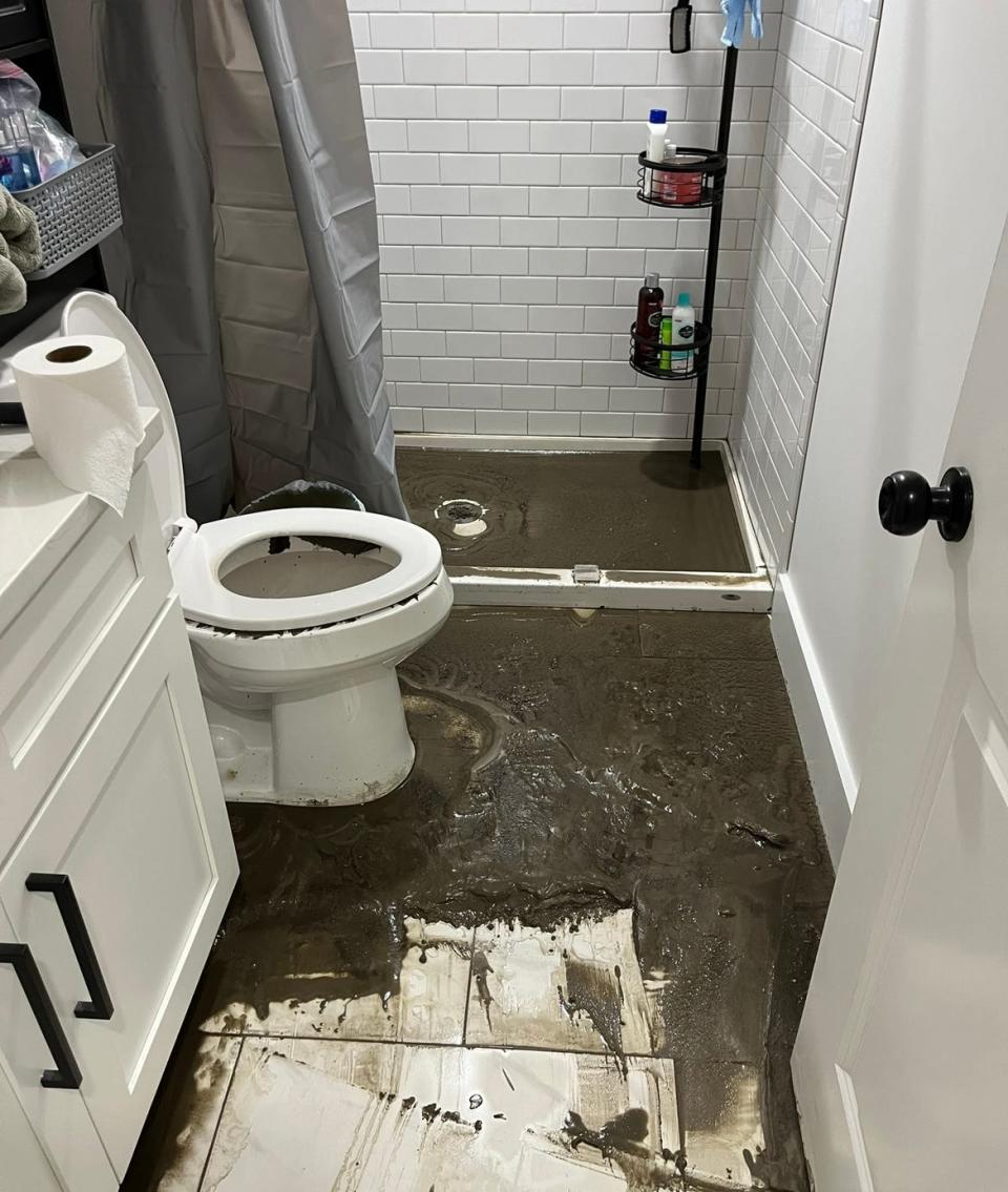 The bathroom of a ground-floor unit at 50 Ashburton St. shows solid waste that backed up from the shower drain and toilet during the March 23 rainstorm. The City of Providence is investigating repeated flooding at the condo complex.