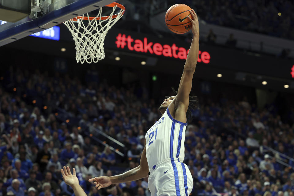 Kentucky's D.J. Wagner (21) goes up for a dunk during the second half of an NCAA college basketball game against Missouri in Lexington, Ky., Tuesday, Jan. 9, 2024. Kentucky won 90-77. (AP Photo/James Crisp)