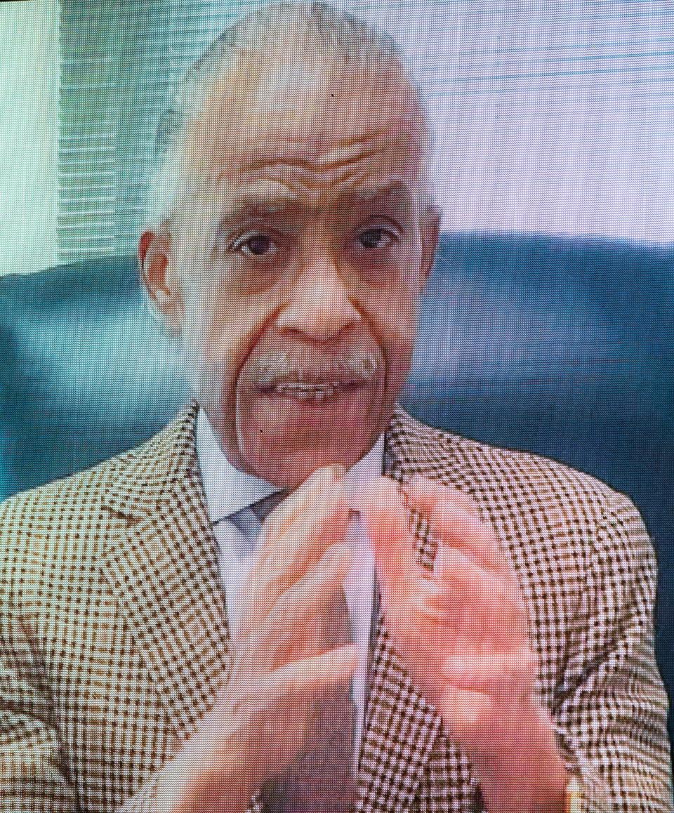 The Rev. Al Sharpton speaks via video during the funeral for Danny Ray, the famous emcee and cape man for James Brown, Saturday morning Feb. 13, 2021, at the James Brown Arena in Augusta, Ga.