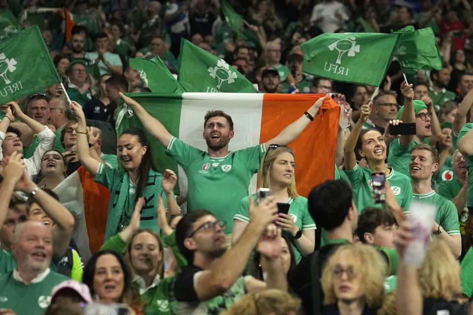 Ireland's fans celebrate as their team won the Rugby World Cup Pool B match between Ireland and Scotland at the Stade de France in Saint-Denis outside of Paris, Saturday, Oct. 7, 2023. (AP Photo/Thibault Camus)