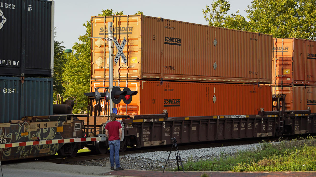 FILE - A CSX freight train runs through a crossing in Homestead, Pa., on Sept. 14, 2022. Most railroad workers weren't surprised that Congress intervened this week to block a railroad strike, but they were disappointed because they say the deals lawmakers imposed didn't do enough to address their quality of life concerns about demanding schedules and the lack of paid sick time. (AP Photo/Gene J. Puskar, File)