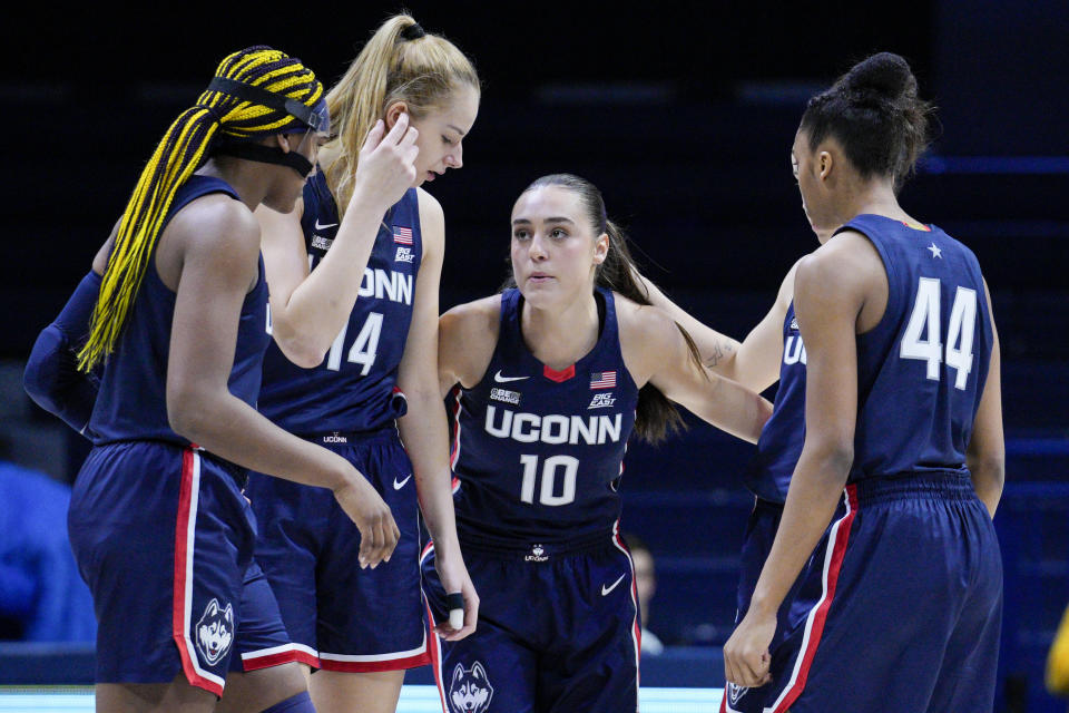 UConn's Aaliyah Edwards, left, Dorka Juhasz (14), Nika Muhl (10) and Aubrey Griffin (44) huddle prior to an NCAA college basketball game against Xavier, Thursday, Jan. 5, 2023, in Cincinnati. (AP Photo/Jeff Dean)