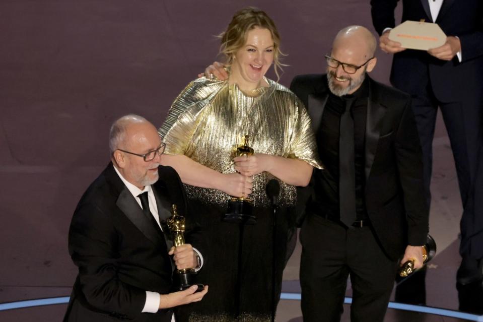 Mark Coulier, Nadia Stacey, and Josh Weston accepted the Best Makeup and Hairstyling award for “Poor Things.” Kevin Winter/Getty Images