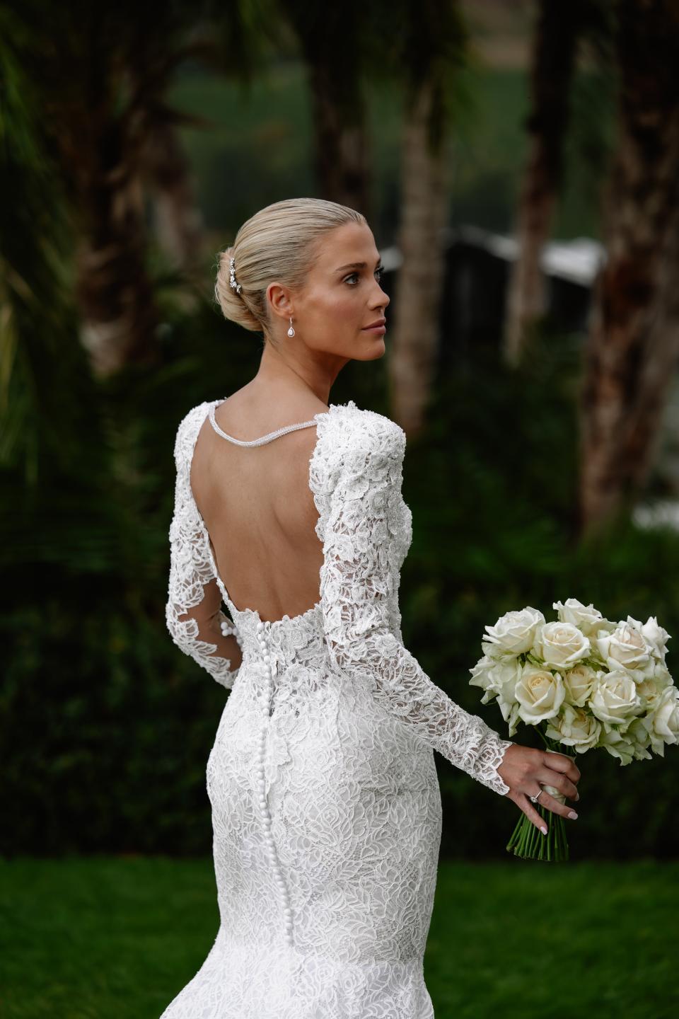 The back of the dress was connected with a single stand of pearls.