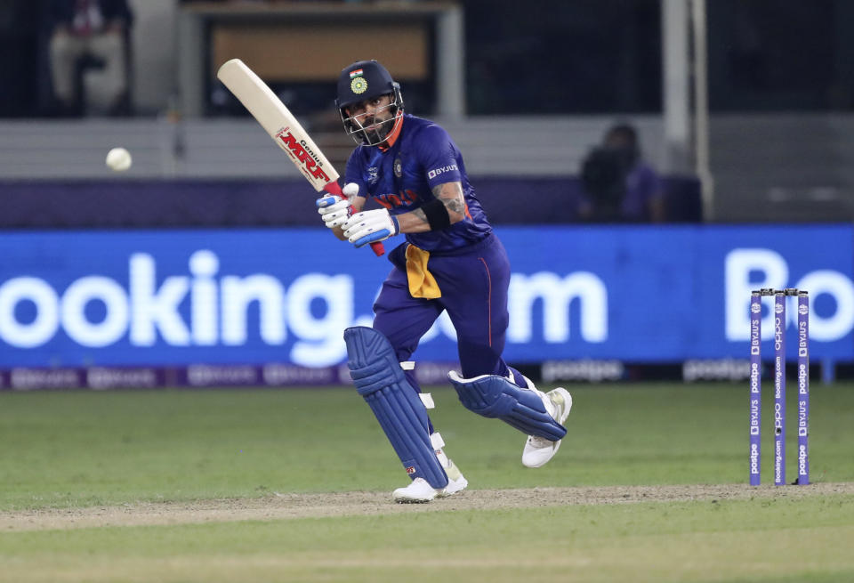 Indian cricket captain Virat Kohli bats during the Cricket Twenty20 World Cup match between India and Pakistan in Dubai, UAE, Sunday, Oct. 24, 2021. (AP Photo/Aijaz Rahi)