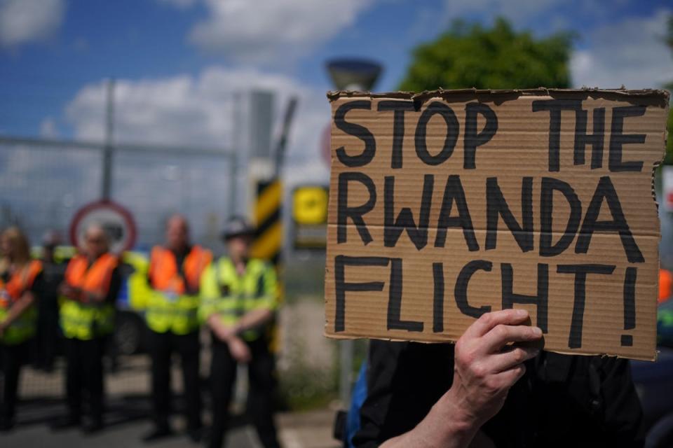 Demonstrators at a removal centre at Gatwick protest against plans to send migrants to Rwanda (PA) (PA Archive)