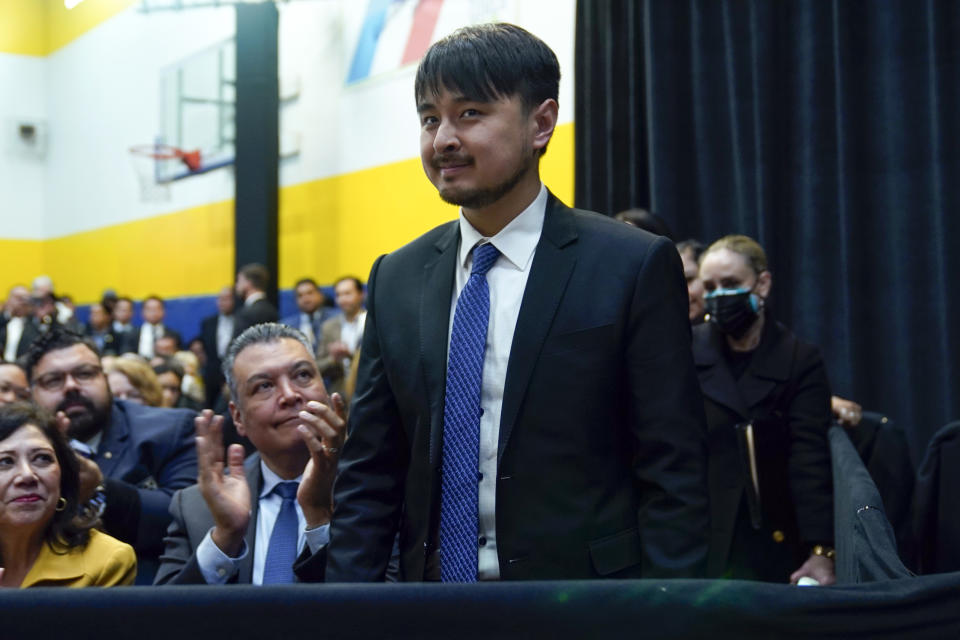 Brandon Tsay stands as President Joe Biden speaks on efforts to reduce gun violence at The Boys & Girls Club of West San Gabriel Valley, Tuesday, March 14, 2023, in Monterey Park, Calif. (AP Photo/Evan Vucci)