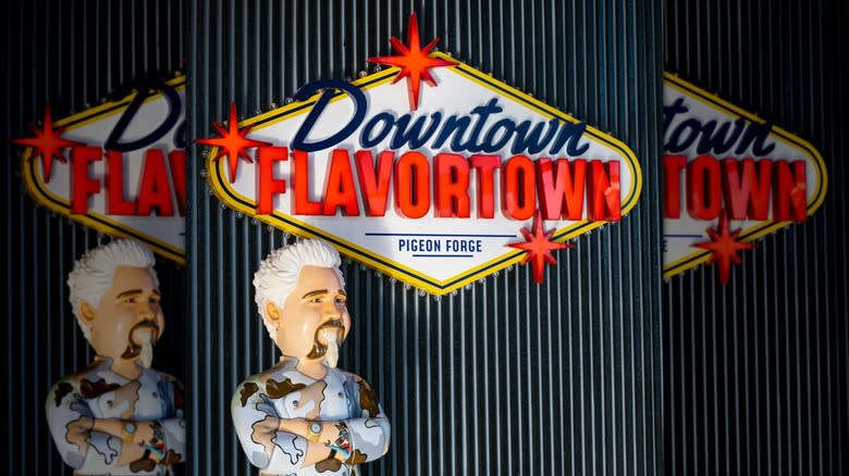 Downtown Flavortown sign with Guy Fieri statue