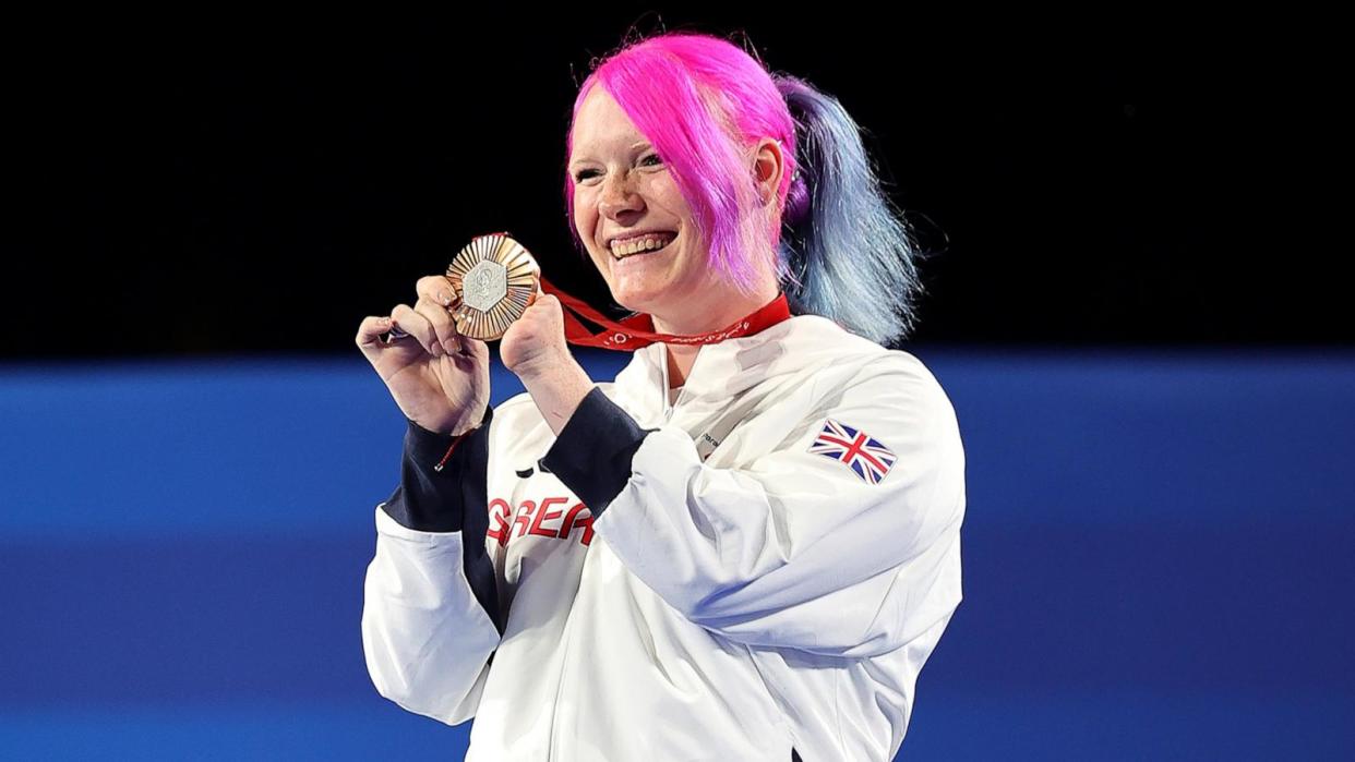 PHOTO: Bronze medalist Jodie Grinham of Great Britain celebrates on the podium at the 2024 Paris Paralympic Games, Aug. 31, 2024. (Alex Slitz/Getty Images)