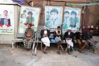 People sit at market cafe in Sanaa