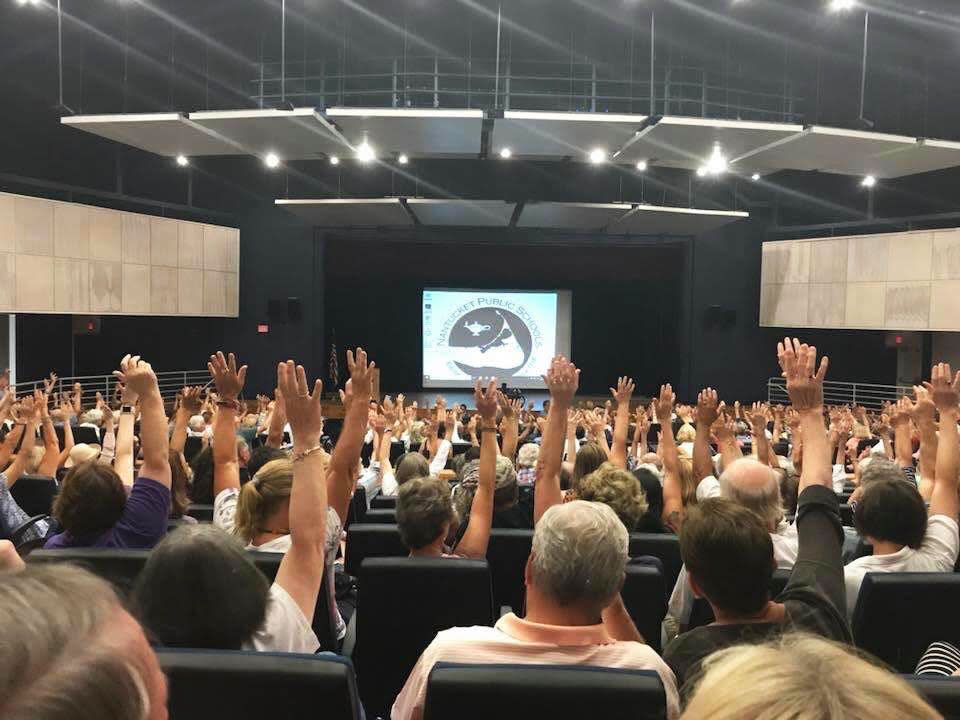 <div class="inline-image__caption"><p>A community hearing on the Surfside Crossing development, where an attorney asked for a show of hands of who was opposed to the project.</p></div> <div class="inline-image__credit">Courtesy of Susan Carey</div>