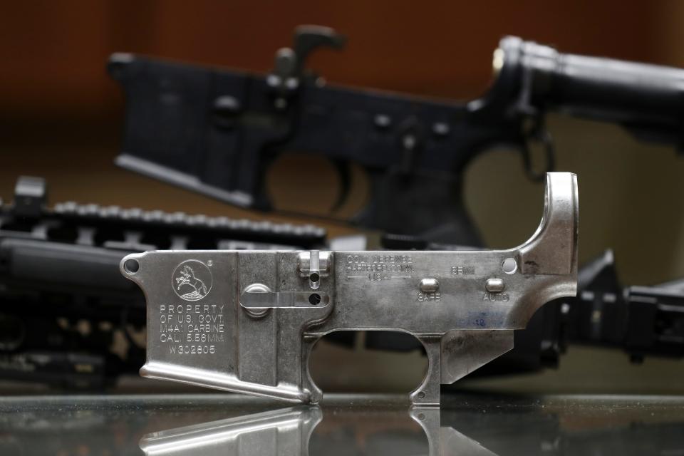 Andrew Scott Pierson was accused of altering Colt M4A1 rifles with counterfeit parts, such as this lower receiver in the foreground on display at the ATF office in Little Rock, Ark. on Dec. 2, 2022, to supply Mexican cartels. Pierson was arrested by Mexican police at the behest of the ATF.