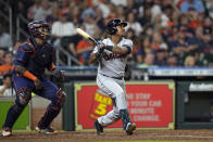 Cleveland Guardians' Jose Ramirez, right, hits a two-run home run as Houston Astros catcher Martin Maldonado watches during the fifth inning of a baseball game Monday, May 23, 2022, in Houston. (AP Photo/David J. Phillip)