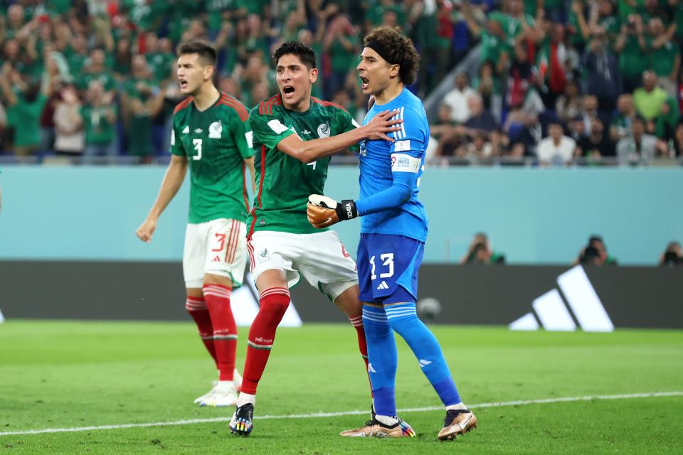 Mexico players celebrate after Guillermo Ochoa stopped a penalty kick.