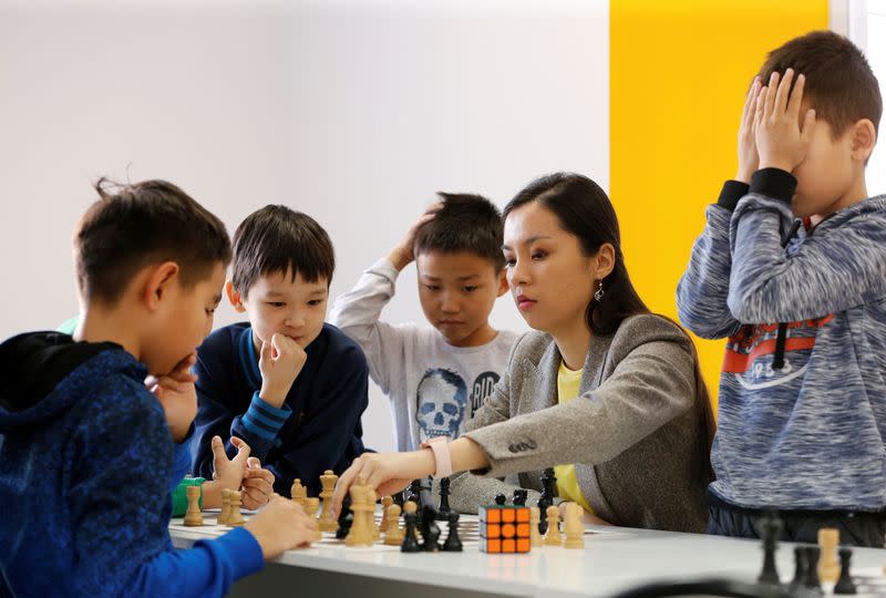Kazakh chess player and social activist Dinara Saduakassova teaches children in the Chess Academy in Nur-Sultan