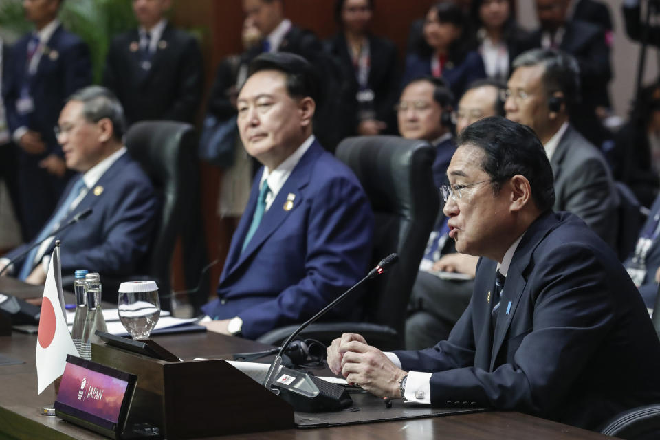 Japan's Prime Minster Fumio Kishida, right, delivers his remarks as South Korean President Yoon Suk Yeol, center, and Chinese Premier Li Qiang listen during the Association of the Southeast Asian Nations (ASEAN) Plus Three Summit in Jakarta, Indonesia, Wednesday, Sept. 6, 2023. (Adi Weda/Pool Photo via AP)