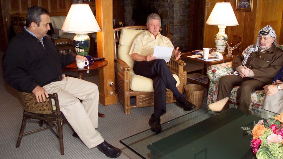 US President Bill Clinton, center, speaks during a morning meeting with Israeli Prime Minister Ehud Barak, left, and Palestinian Chairman Yasser Arafat July 25, 2000 at Camp David in Maryland. Clinton announced later in the day that the Middle East peace summit had collapsed because of a deadlock over the status of the disputed city of Jerusalem.  - Ralph Alswang/Newsmakers/Getty Images