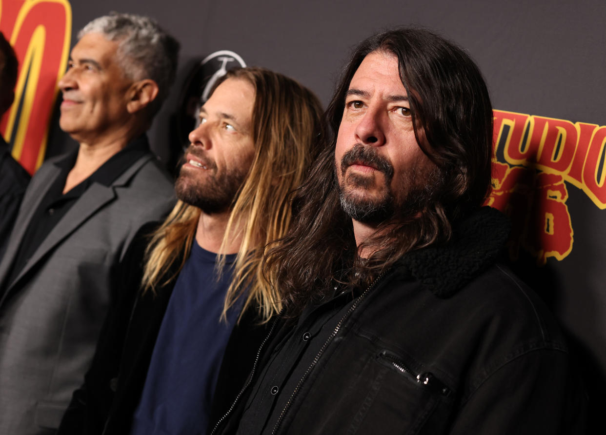 Pat Smear, Taylor Hawkins, and Dave Grohl of Foo Fighters attend the Los Angeles premiere of &#39;Studio 666&#39; at Hollywood&#39;s TCL Chinese Theatre just one month before Hawkins&#39;s death. (Photo: Rich Fury/Getty Images)