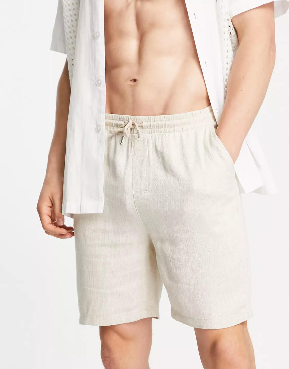 A pair of linen men's shorts are perfect for keeping cool in the summer. (ASOS)