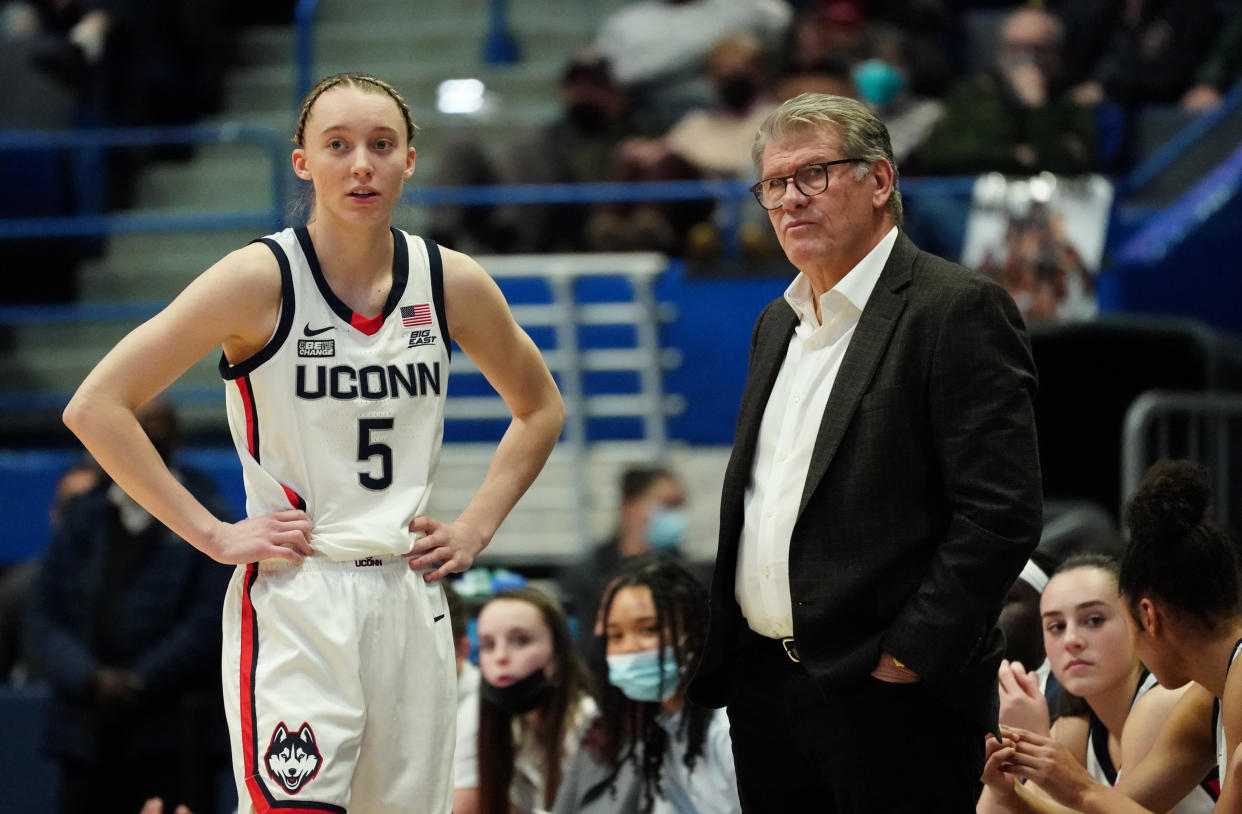 Feb 25, 2022; Hartford, Connecticut, USA; UConn Huskies head coach Geno Auriemma talks with guard Paige Bueckers (5) from the sideline as they take on the St. John's Red Storm in the second half at XL Center. Mandatory Credit: David Butler II-USA TODAY Sports