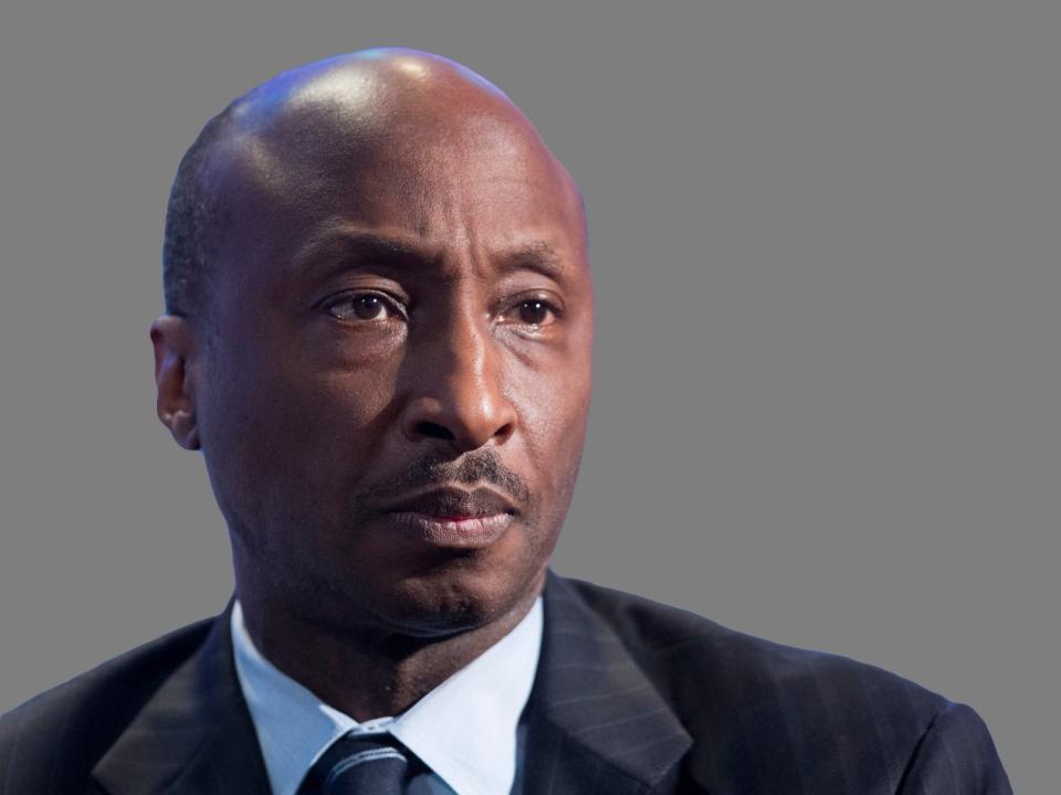 Kenneth Frazier  headshot, as Merck pharmaceutical company Chairman of the board, president, and CEO, graphic element on gray