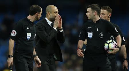 Manchester City v Liverpool - Premier League - Etihad Stadium - 19/3/17 Manchester City manager Pep Guardiola speaks with referee Michael Oliver after the game Reuters / Andrew Yates Livepic