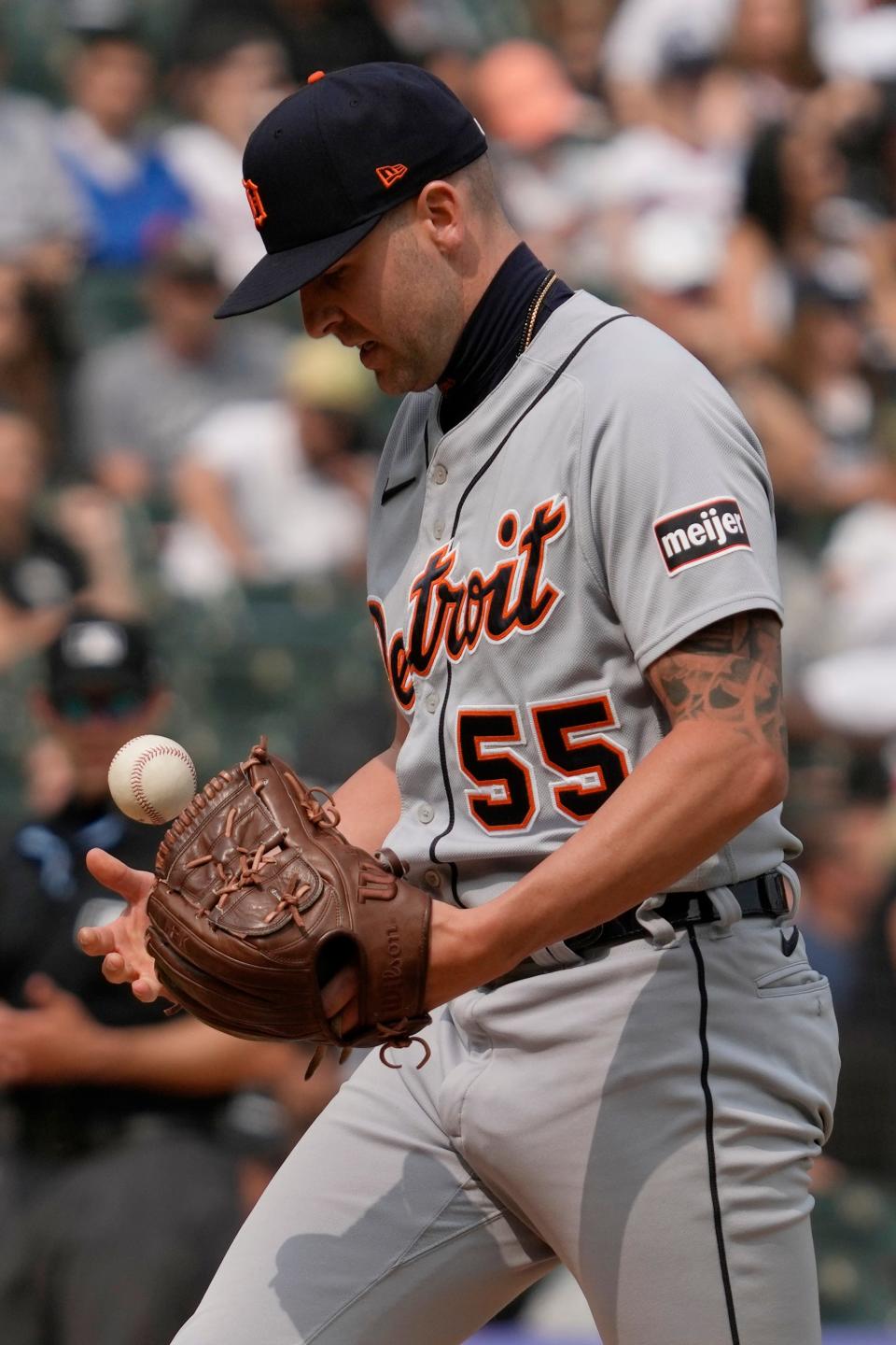 Detroit Tigers relief pitcher Alex Lange tosses a ball during the ninth inning of a baseball game against the Chicago White Sox at Guaranteed Rate Field in Chicago on Sunday, June 4, 2023.